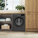 Beko WFST107XA washing machine — in-kitchen lifestyle view | 10 kg, 1400 RPM, Dark Grey — غسالة بيكو WFST107XA — منظر داخل المطبخ | 10 كيلو، 1400 لفة، رمادي غامق